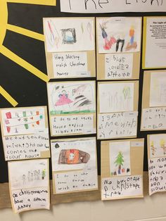 several children's drawings are posted on the bulletin board in front of their classroom