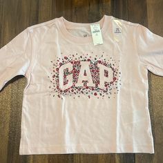 New Gap Girls Tee, Never Worn Gap Tops With Graphic Print For Spring, Cute Gap Tops For Fall, Gap Graphic Print Tops For Spring, Cute Gap Crew Neck Top, Pink Gap Tops For Spring, Gap Pink Tops For Spring, Gap Pink Tops For Fall, Pink Gap Tops For Fall, Gap Long Sleeve Top With Letter Print