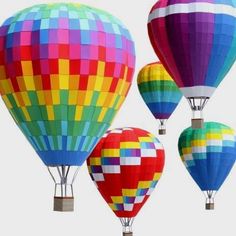 several colorful hot air balloons are flying in the sky with different colors and shapes on them