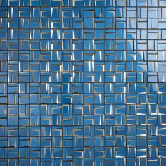 an image of blue glass tiles in the shape of squarees and rectangles