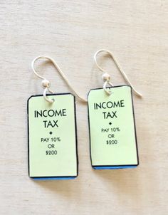 two tags with the words income tax on them