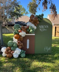 a football themed balloon arch in the yard