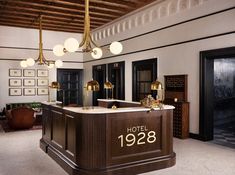 a hotel lobby with an antique bar and chandelier