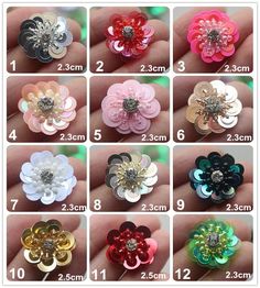 different colors and sizes of flower hair clips for girls with crystal stones on the center