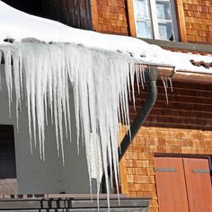 icicles hanging from the roof of a house