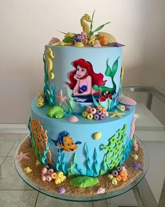 the little mermaid cake is decorated with fondant