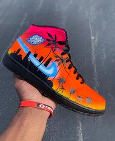 These are my custom  Sunset Jordan's. my customs are all special in every way and no pair will be the same. All customs are made to order, and hand painted. If you want something done that you don't currently see in my shop shoot me a message and let's make it happen! custom sunset shoe I custom sunset sneaker | air jordan customs | tropical custom | nike air force 1 | sunset sneakers | Jordan sneakers | Coopskicks | flower custom | coops kicks | sunset Jordan's | birthday gifts | summmer style | custom paint shoe Miami Palm Trees, Jordan 1 Green, Air Jordan 1 Blue, Custom Air Jordan 1, Jordan 1 Mids, Miami Sunset, Jordan 1 Blue, Basketball Stuff, Painted Nikes