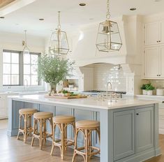 a large kitchen island with stools next to it