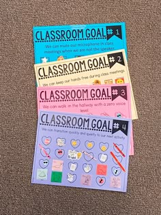 a pile of classroom goal stickers sitting on top of a brown carpeted floor