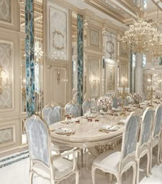 a fancy dining room with blue and white chairs