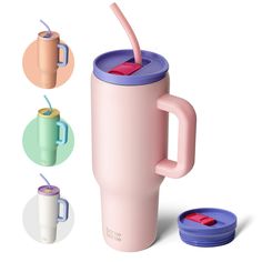 a pink coffee cup with a straw in it and three different colored cups next to it