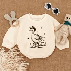 Silly Goose On The Loose Baby Outfit, Newborn Clothes Baby Boy, Howdy Duck Baby Bodysuit, Birthday Baby Gift, Funny Shirt for Kids HOW TO ORDER v Choose Romper Sizes v Select design color if applicable v For personalized designs - enter customization in the "Add your personalization" field v ADD TO CART v Select from our shipping class options. 📦 PRODUCTION TIME & SHIPPING ► All items are handmade-to-order ► Production time is in 1-2 days ► We ship all orders next business day after processing time ► USPS First Class, Priority and Express available at checkout ► Delivery time is 4-7 days in the US, and approx. 8 -10 days internationally. FOR YOUR QUESTIONS ? If you cannot find the answer to your question, please shoot us a message. We strive to reply immediately and will do everything we Silly Goose On The Loose, 1 Silly Goose Birthday, One Silly Goose Birthday Party Boy, Silly Goose Birthday, One Silly Goose, Silly Goose Birthday Party, Baby Onesies Cricut, One Silly Goose Birthday, Goose Birthday