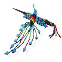 a bird made out of beads on a white background with no image to describe it