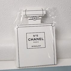 a bottle of chanel no 5 perfume sitting on top of a white countertop