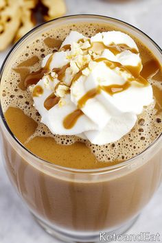 there is a drink with whipped cream and caramel on top