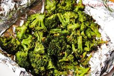 cooked broccoli in aluminum foil sitting on a table