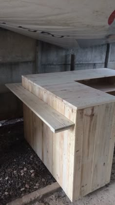 a wooden bench sitting in the middle of a room