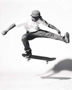 black and white photograph of a skateboarder in mid air doing a trick with his board