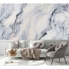 a living room with marble wallpaper and chairs