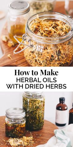 jars filled with herbs sitting on top of a wooden table