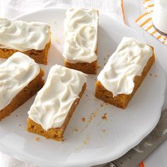 several pieces of cake on a plate with frosting