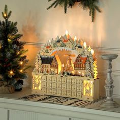 a christmas scene with a lit up gingerbread house