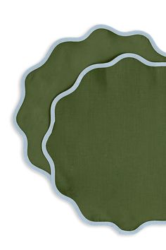 a green place mat with white trim on it and a blue border around the edge