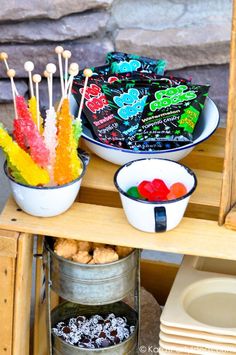 there are many candies in bowls on the table