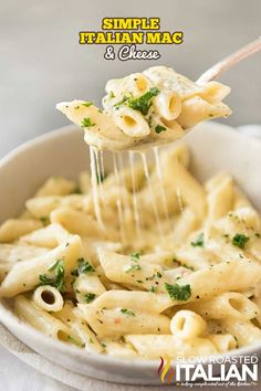 a spoon full of macaroni and cheese being lifted from a bowl with the title italian style macaroni and cheese