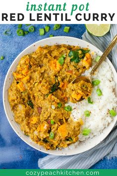 a white bowl filled with rice and vegetables next to a spoon on a blue cloth