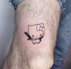 a hello kitty tattoo on the ankle