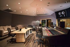 an empty recording studio with lots of equipment