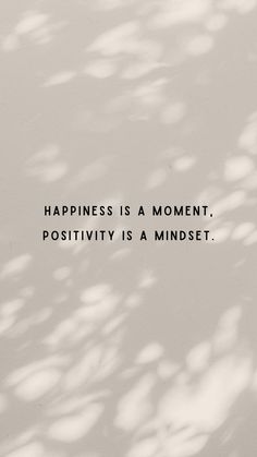 the words happiness is a moment, positivity is a mindset