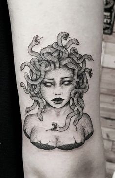 a woman's head with snakes on her arm and the word, snake in it