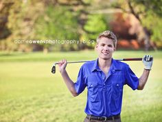 a young man holding a golf club in his right hand and smiling at the camera