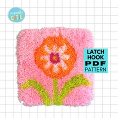 the latch hook pattern is designed to look like an applique with flowers on it