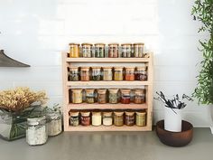 an assortment of spices and herbs on a shelf