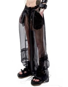 RELAXED-FIT WIDE-LEG LIGHTWEIGHT SEMI-SHEER ORGANZA CARGO PANTS IN BLACK WITH ETHEREAL EFFECT. BELT LOOPS. ZIP-FLY. CONCEALED VELCRO FASTENING AT FRONT WAISTBAND. DARTS AT BACK. 6-POCKET STYLING. LOOSE THREAD OVERLOCK ROOTS DETAILING THROUGHOUT. *MIX WITH SHORTS/LEGGINGS/HALF SKIRT WAIST BAG TO REACH OPACITY, BUT KEEP ETHEREAL EFFECT OF THE LOOK.COMPOSITION & CARE:BODY: ORGANZA100% POLYESTER DRY CLEAN ONLY. MEDIUM TEMP IRON. DO NOT BLEACH.MADE IN UKRAINE MODEL ANDRA IS 5FT 9" (175CM) TALL, CHEST Half Skirt Half Shorts, Half Pants Outfit, Tulle Pants, Organza Jacket, Hedge Fund Manager, Sheer Pants, Hedge Fund, Black Layers, Tall Chest