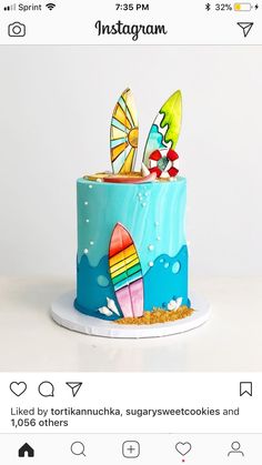 a cake decorated with surfboards and sand