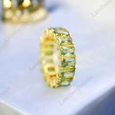 Baguette Cut Peridot Wedding Band, Delicate Art Deco Bridal Band, Women's Fine Jewelry August Birthstone Gifts Elegant Design Birthday Rings Ring Description: - Main Stone- Peridot Cut of Stones - Faceted  Stone size -  6 x 3 MM Stone Color- Green Stone Shape - Baguette Creation- Lab Created Birthstone- August Check out my other items! PAYMENTS   We accept PayPal, If we do not receive payments immediately we will hold the item only for one working day for your payments and we will be re-listing the item afterwards. if there is a difficulty of paying for the item/s you have bought immediately please contact us so we can hold your item. FEEDBACK Please contact us if you have any problem with the product before leaving negative feedback, opening a case or a return request. we will try our ver Green Peridot Birthstone Ring For Formal Events, Green Peridot Birthstone Ring For Formal Occasions, Yellow Stone Wedding Jewelry, Fine Jewelry Peridot Birthstone Ring With Center Stone, Peridot Baguette Ring, Green Peridot Birthstone Ring, Peridot Wedding Band, Design Birthday, Baguette Ring