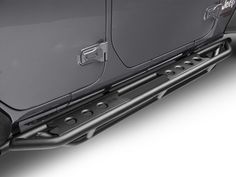 the front bumper and side steps of a black jeep