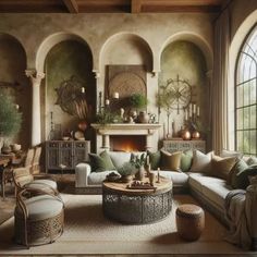 a living room filled with furniture and a fire place next to a large arched window