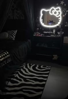 a bedroom with a hello kitty mirror and zebra print rugs on the floor in front of it