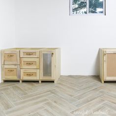 two wooden cabinets sitting next to each other on top of a hard wood floor in front of a window