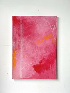 an abstract painting on a white wall with pink and orange colors