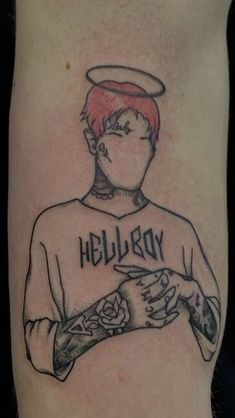 a man's tattoo with the word hellboy on it