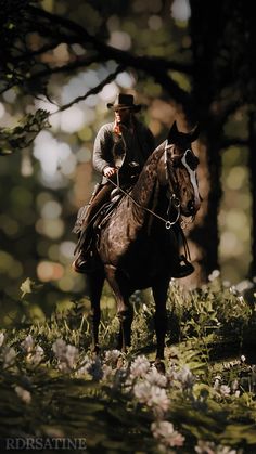 a man riding on the back of a brown horse through a forest filled with flowers