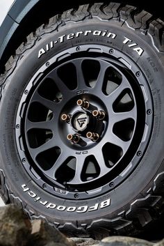 an all terrain truck tire on rocks with the word, altebronn ta written on it