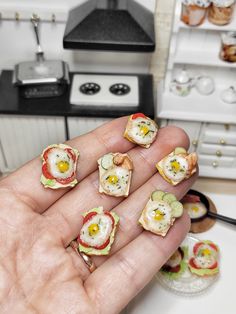 a person holding food in their hand with eggs on top and cucumber slices around them