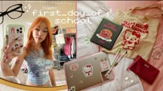 a girl with red hair is looking at her cell phone and other items on the bed